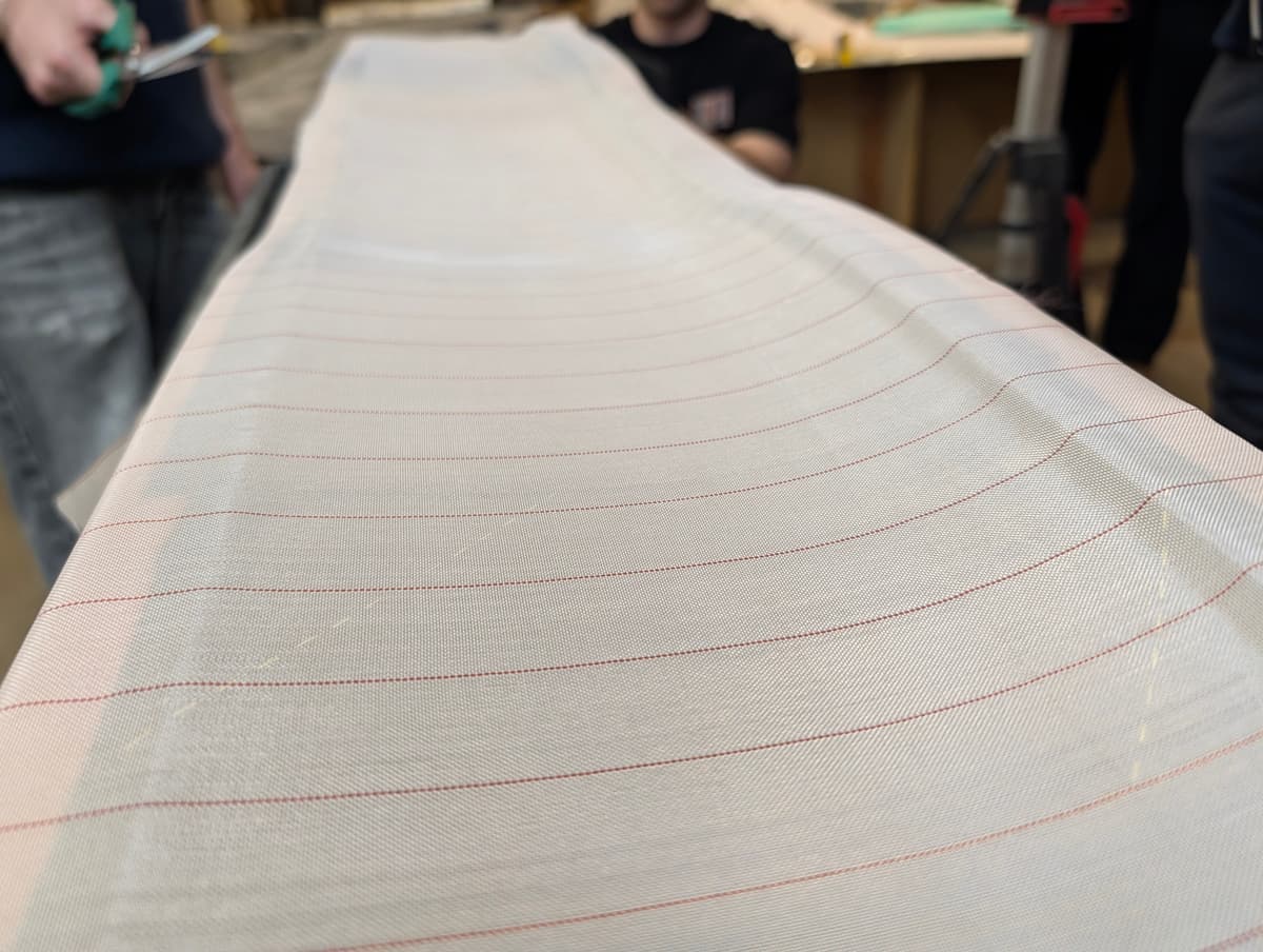 Cutting peel ply material for the layup