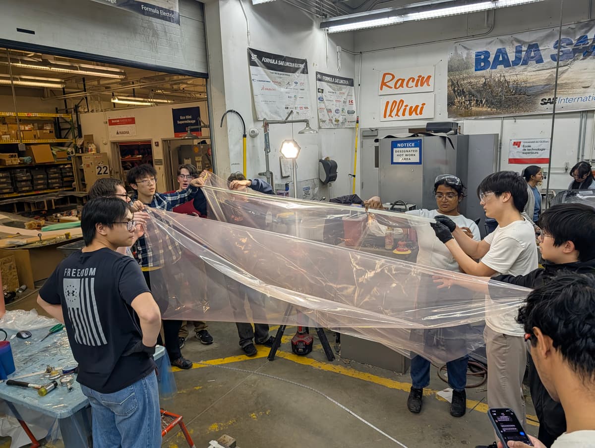 Team collaborating on a large composite layup